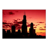 Chicagos Skyline appears in silhouette at sunset